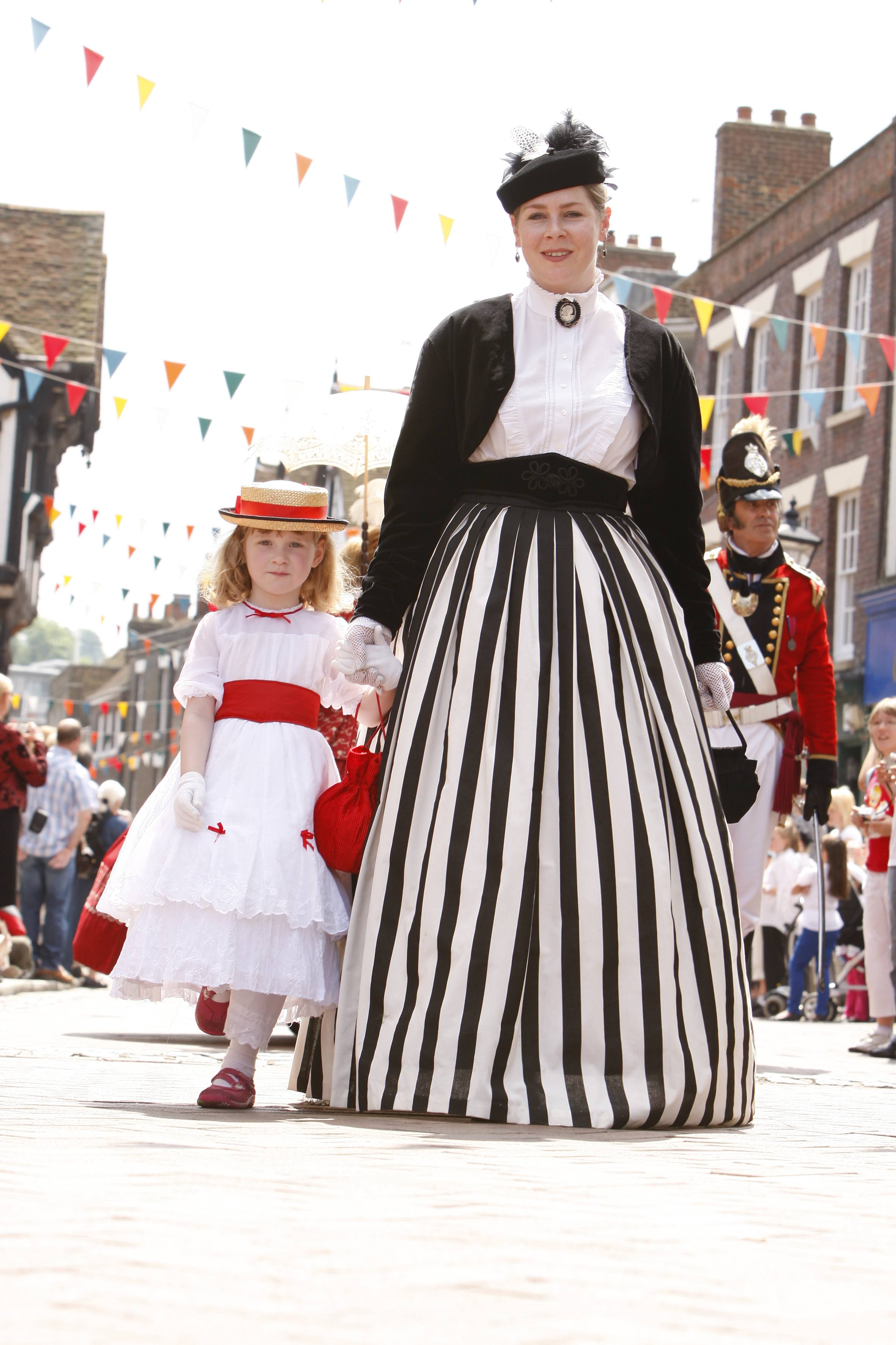 Parade mother and daughter in costume